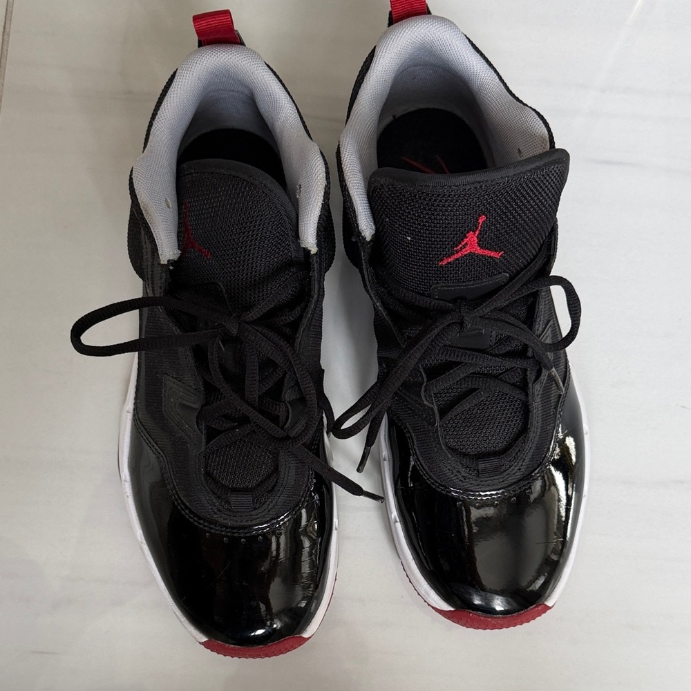 Jordan Black and Red Low-Top Sneakers with White Midsoles